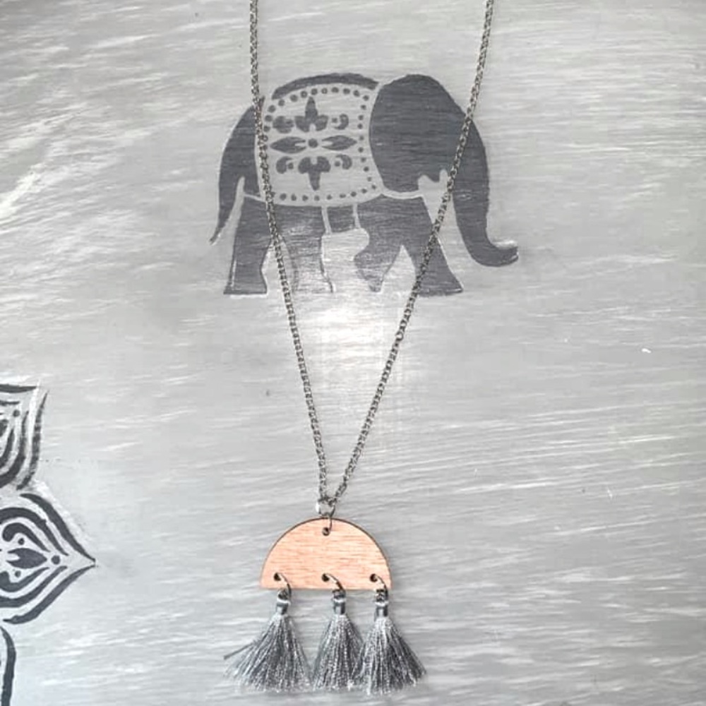 A Handmade Necklace with a Wood Tassel Pendant